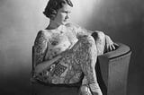 Betty Broadbent, the ‘Tattooed Venus’, Sydney, 1938. Regarded as the most photographed tattooed lady of the 20th century. photographer Ray Olsen, Pix Magazine, State Library of New South Wales. 4 April 1938. (Image source: Public Domain).