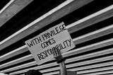 Black Lives Matter protest sign saying, “With privilege comes responsibility”