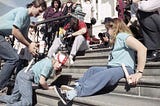 Picture from the original ADA protests of protesters crawling up a set of stairs at the Capitol building