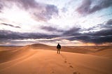 Man walking alone in the desert