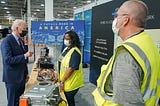 Biden speaks to Ford workers in front of a banner that reads, “A Future Made In America.”