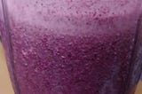 Blue berry Smoothie in a Nutribullet cup half full.