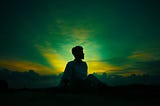 A person with sunlight illuminating them. You can only open your mind.