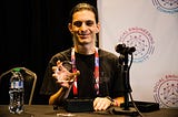 Jason Puglisi, author and contestant, holds a second place trophy during the DEF CON 30 Social Engineering Community Vishing Competition contestant panel.