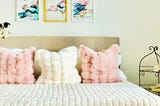 Faux bunny fur throw pillows in pink and cream
