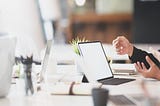 Two HR rep hands wave about in front of a computer as they try to determine what to do and what not do in regard to employee engagement.