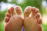 ten toes with smiley faces on each one