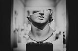 A sculpture with head chopped off/Photo by Levi Meir Clancy on Unsplash