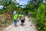 Volunteers travel to farmers’ fields to administer LF medicine during an annual distribution of LF medicine in 2022. Photo credit: RTI International/ Emmanuel Riscka Chery