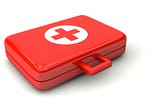 First aid kit in red briefcase