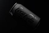 A black matte coca cola can with glossy logo
