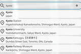 A search box with semi-circle edges on both sides shows the search term _kyoto_, below which five boxes of the shape similar to the search box show autocomplete suggestions: Kyoto, Kyoto Station, Kyoto University, Kyoto Katsugyu, and Kyoto Railway Museum. In these suggestions, the phrase _Kyoto_ is highlighted in bold.