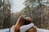 Best friends, all long hair don’t care, having each other’s back in the midst of autumn.