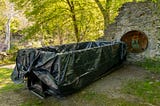A 20-cubic yard waste container, lined with plastic, is in place May 17 at the Ithaca Falls Natural Area where a contractor working under EPA supervision will remove lead and arsenic contaminated material from the gorge near Ithaca Falls.