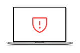 macbook screen with a warning security sign