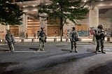 Federal Marshals in front of the Portland Federal courthouse building