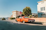 Source: https://www.pexels.com/photo/red-vintage-car-stopped-on-the-crossroads-15706251/