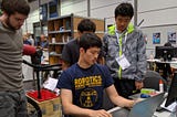 Students programming a robot during the Amazon Picking Challenge, 2016