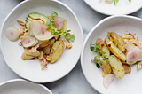 Spring potato salad with avocado, radishes and mustard croutons