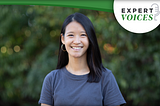 World Learning’s Director of Virtual Programming Jennifer Chen smiling at the camera, with trees blurred out behind her.