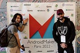 Pablo and Jordan in front of AndroidMakers banner