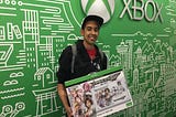 Chris (DeafgamersTV) Robinson holding a Tekken 7 Xbox fightstick at a Microsoft Conference in Seattle, WA.