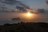 first sunset in the world, globe trotters, east cape new zealand.