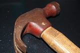 Traditional hammer on tabletop