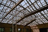 How do long-span roof structures behave?