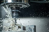 CNC machining drilling holes in steel using metal working lubricants