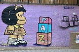 Mural of Mafalda with blocks that spell peace.