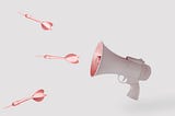 Copper arrows and beige megaphone on isolated pastel background