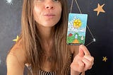 Rozalia Kieliszkiewicz holding the Ace of Pentacles Major Arcana Tarot Card