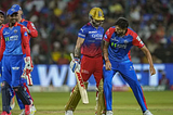 Delhi Capitals’ Ishant Sharma celebrates the wicket of Royal Challengers Bengaluru’s Virat Kohli during an Indian Premier League (IPL) 2024 T20 cricket match between Royal Challengers Bengaluru and Delhi Capitals, at the M Chinnaswamy Stadium, in Bengaluru.