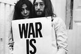 Yoko Ono and John Lennon on the steps of the Apple building in London during a peace campaign protesting against the Vietnam War, December 1969.
