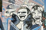 Street art dipicting two youths, a train and town hall clock tower.