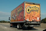 Cheeto truck on the road.