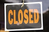 closed sign on a business