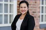 Image of woman in business jacket.