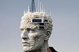 An artificial-looking human head with a cell tower and other electronics embedded in it.