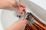 How often should makeup brushes be cleaned