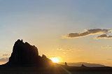 A sunset portrait of Shiprock, New Mexico.