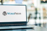 Laptop with “WordPress” logo on screen. Agency Name/Contributor Name — stock.adobe.com