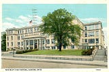 The image shows a painting of the old McKinley High School in Canton, Ohio, as it was in the 1930s.