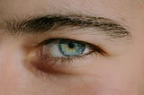 close up of man’s blue eye