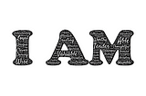 “I am” in a black font made up of other words on a white background