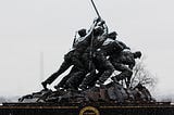 Marine Corps War Memorial — “Uncommon Valor Was A Common Virtue” — Photo by Mark Tegethoff on Unsplash