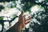 Selective focus of a hand reaching out