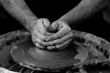 potter making a pot