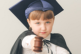 A boy dressed as a judge